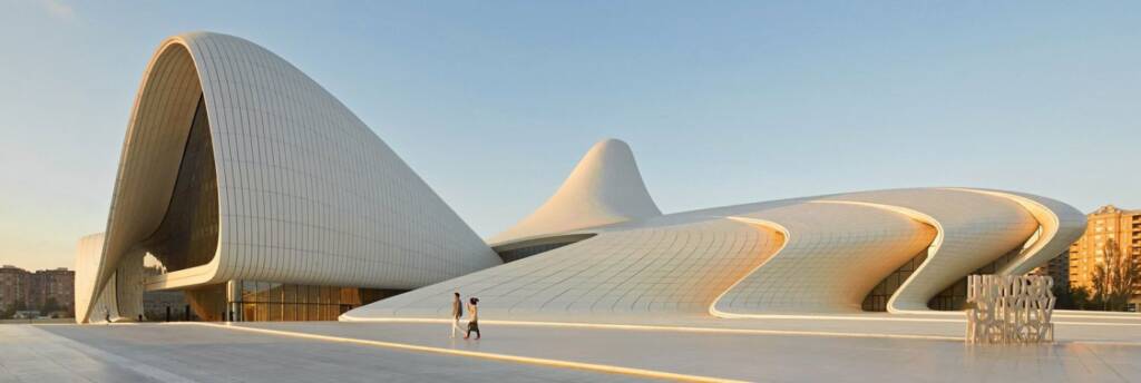 The sweeping white curves of the Heydar Aliyev Center in Baku, designed by architect Zaha Hadid — a seamless flowing structure against a deep blue sky to do in Baku Baku travel guide 2026