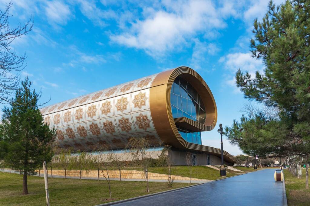 The exterior of the Azerbaijan Carpet Museum on Baku's waterfront — a building uniquely designed to resemble a giant rolled traditional carpet to do in Baku Baku travel guide 2026
